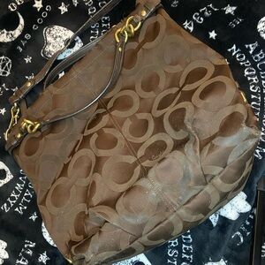 Brown coach purse. Some wear and tear but overall decent condition.